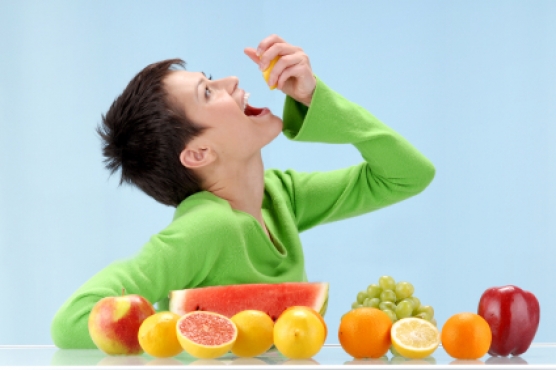 Young girl eating healthy, fresh whole foods