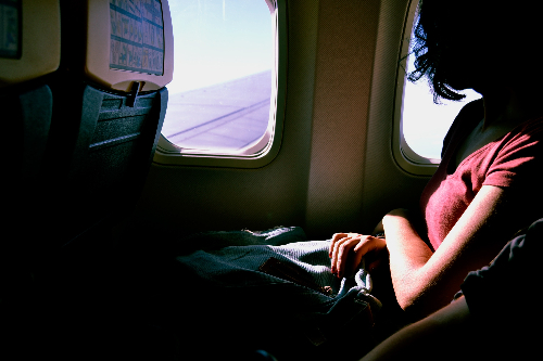 Fear of Flying Hypnotherapy, lady looking out a plane window